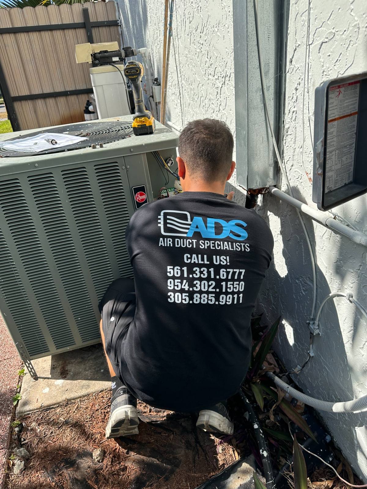 Air Duct Specialists LLC technician performing AC repair in Miami and Broward County FL