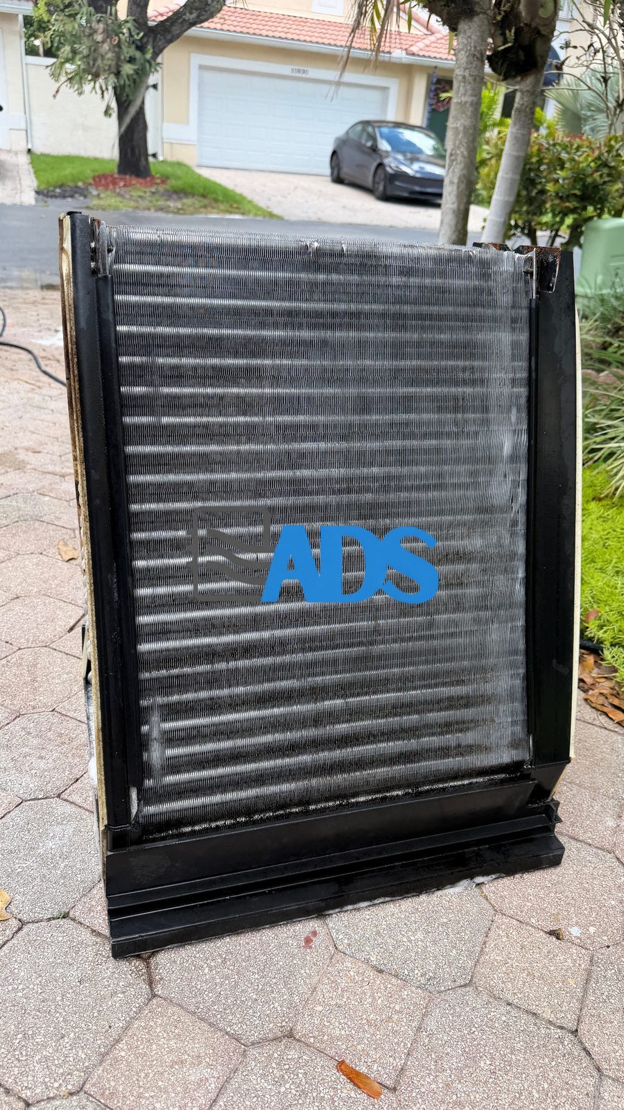 The same evaporator coil after cleaning, fins clear and airflow restored