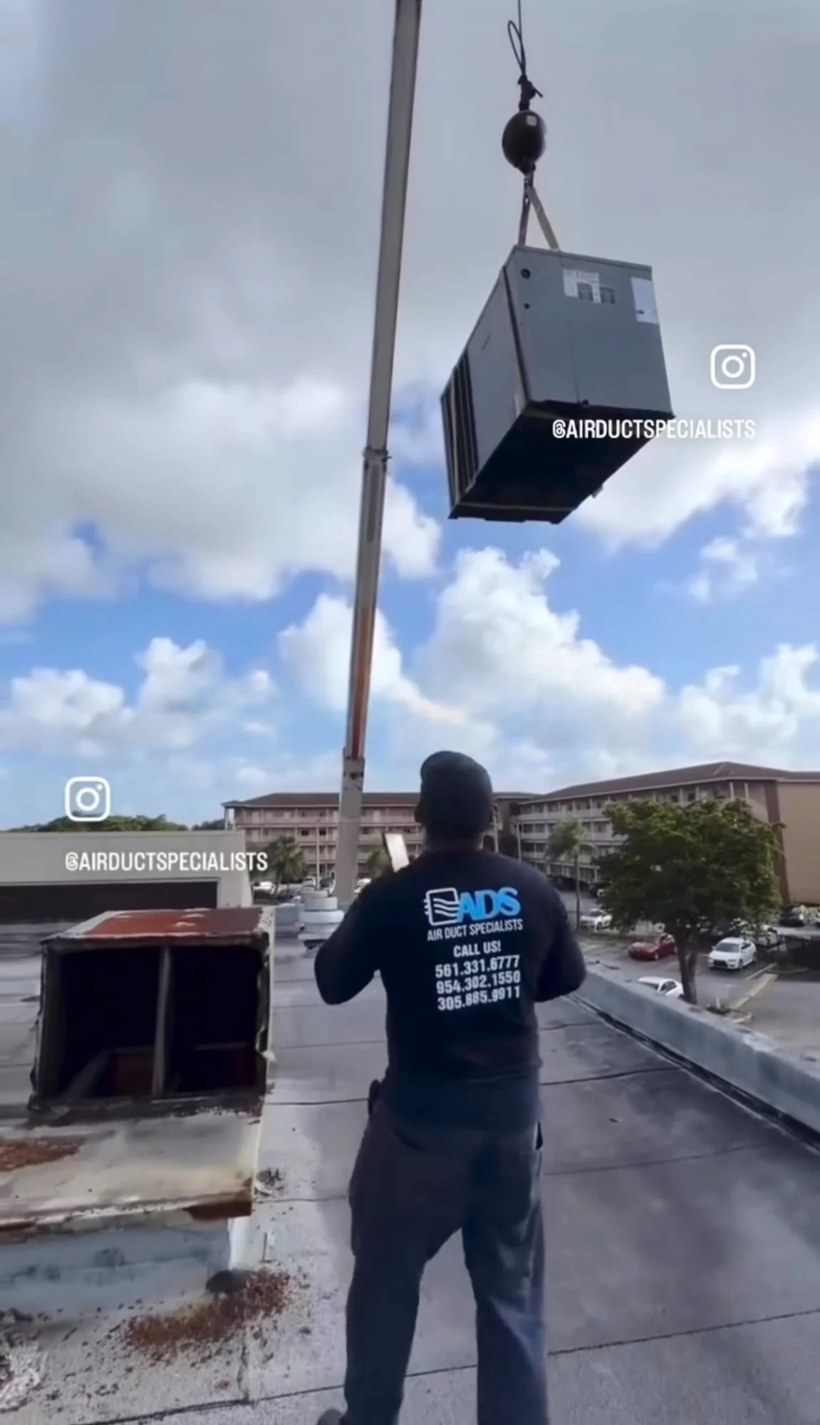 Commercial AC installation crane lift Miami FL — Air Duct Specialists LLC