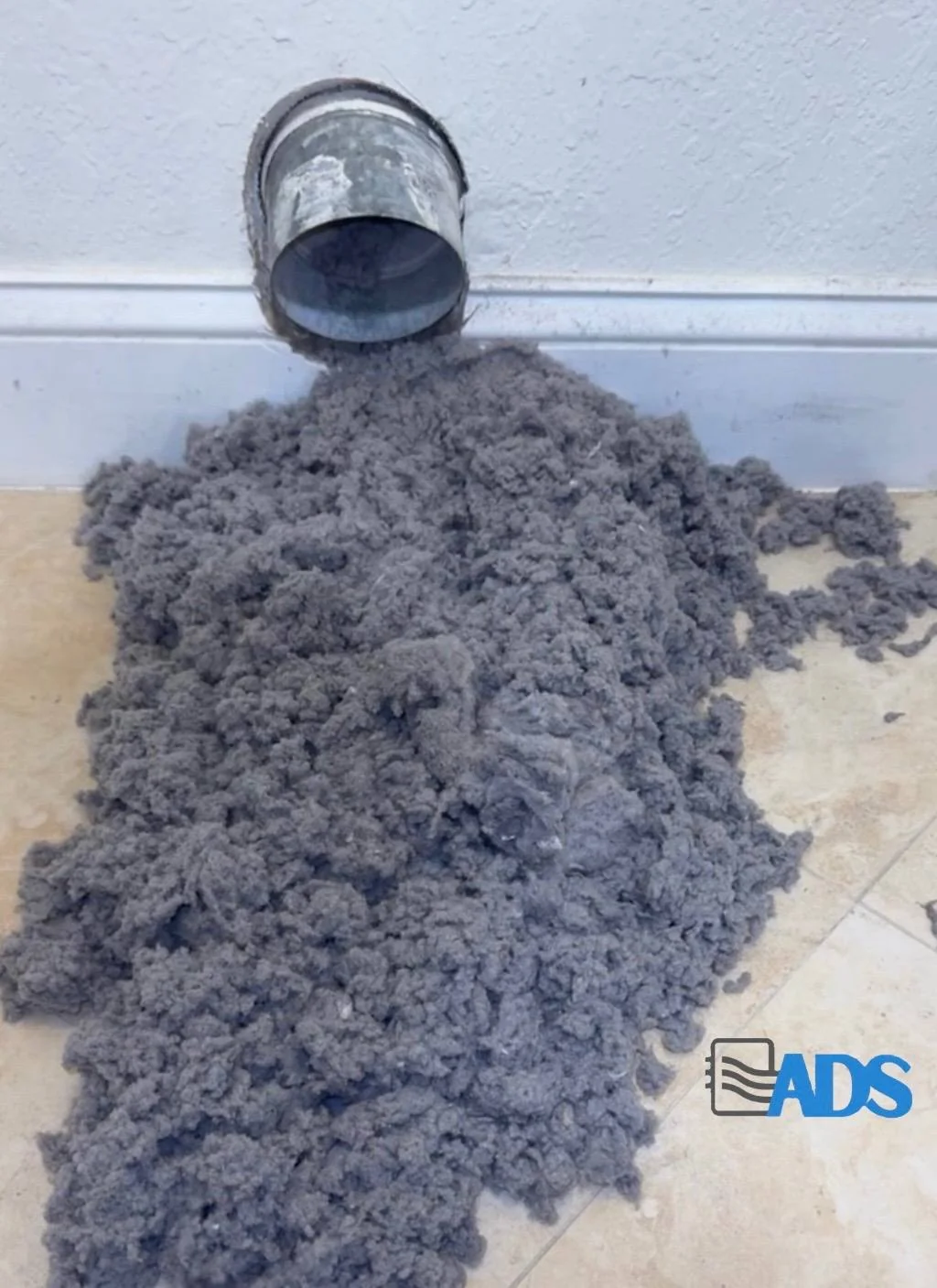 Massive lint buildup removed from dryer vent South Florida — fire hazard prevention by Air Duct Specialists LLC