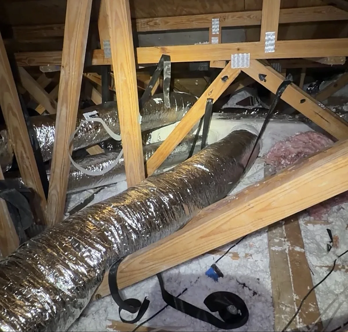 Newly installed ductwork in a South Florida attic, sealed with professional-grade products